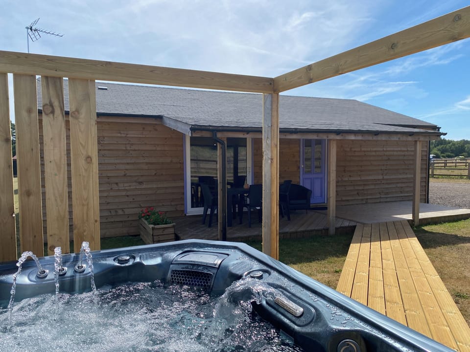 Covered deck area and walk-way to the hot tub
