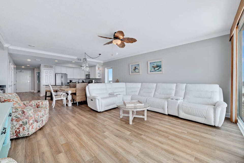 A light-filled living space with captivating views. This inviting room offers a perfect blend of comfort and style, creating a welcoming atmosphere for all.