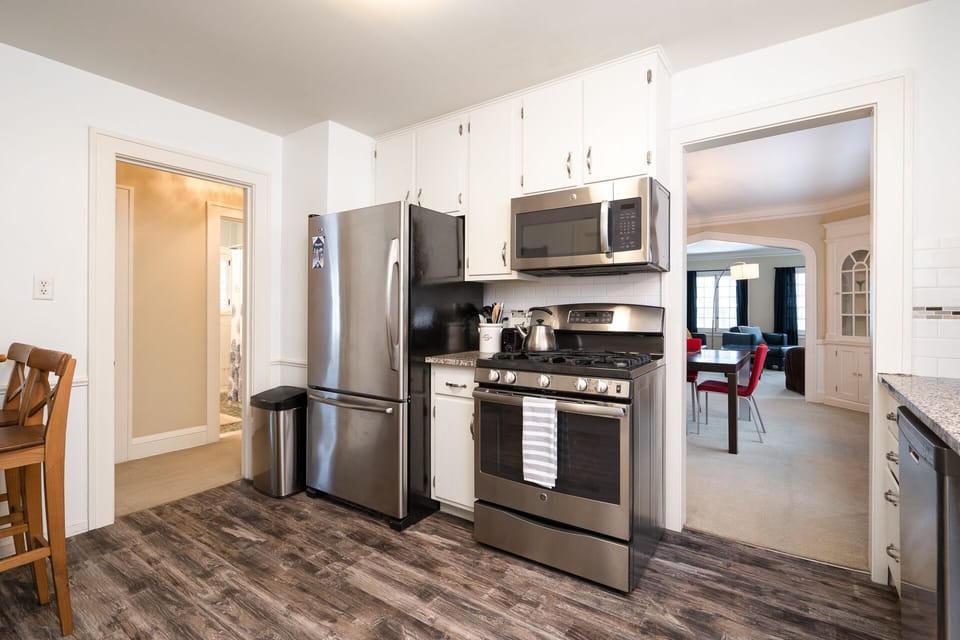 Stainless steel appliances in a fully stocked kitchen