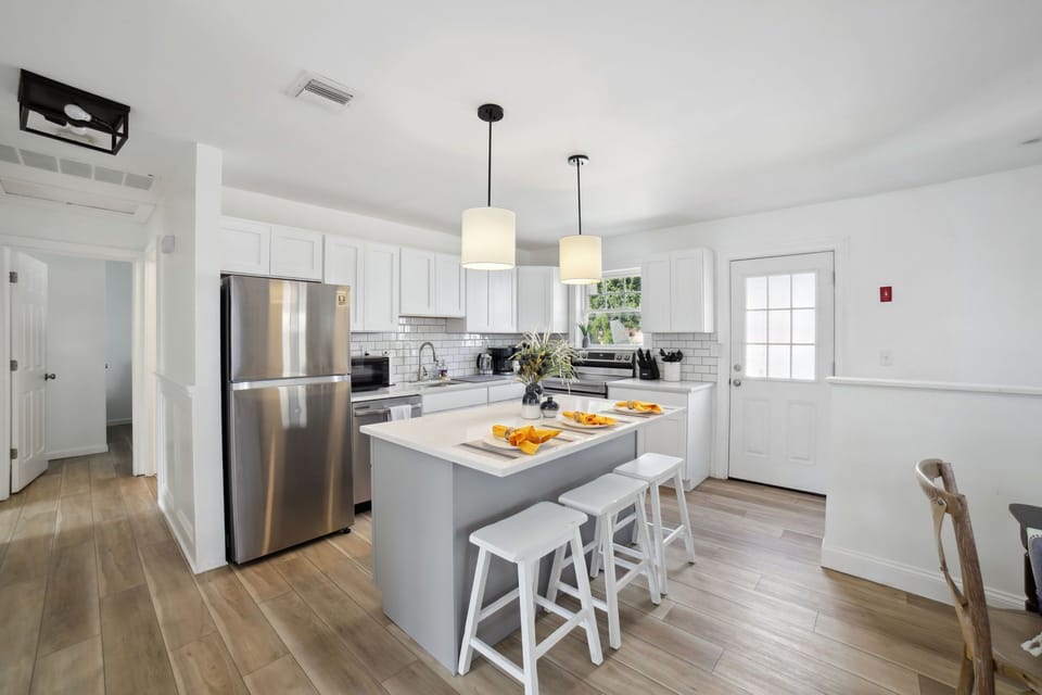 Whole view of the kitchen with 3-seater island kitchen