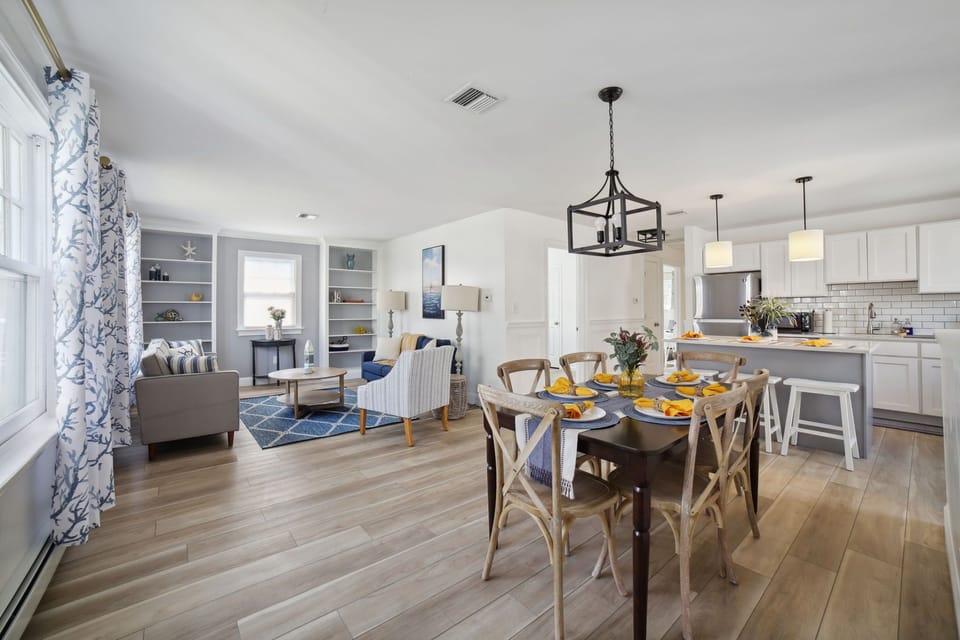 Whole view of this area showing the kitchen, dining area, and second living room