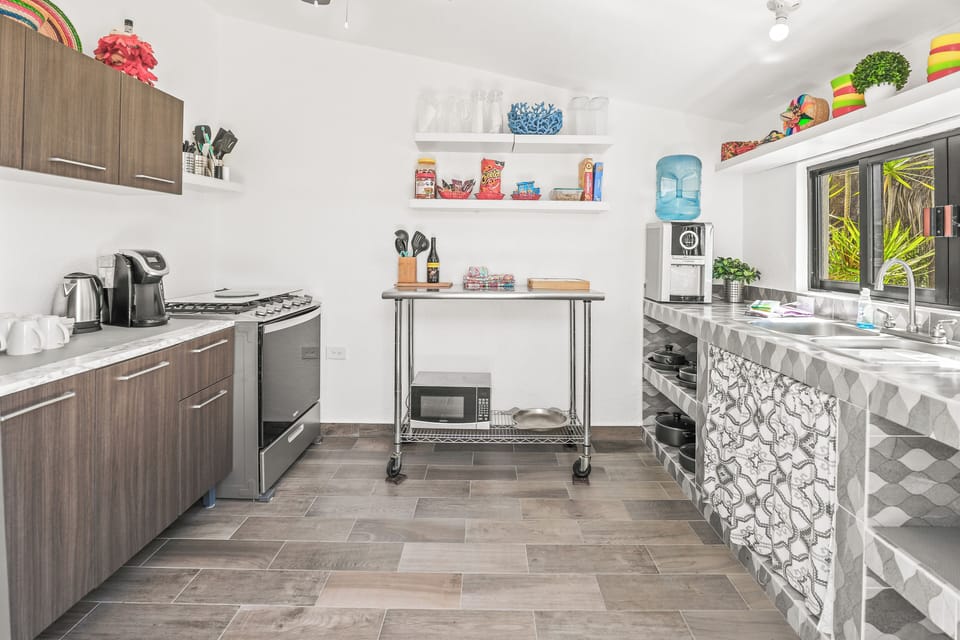 Full Kitchen, Stove, Refrigerator, Microwave, Coffee Maker, Dishes, Pots & Pans.