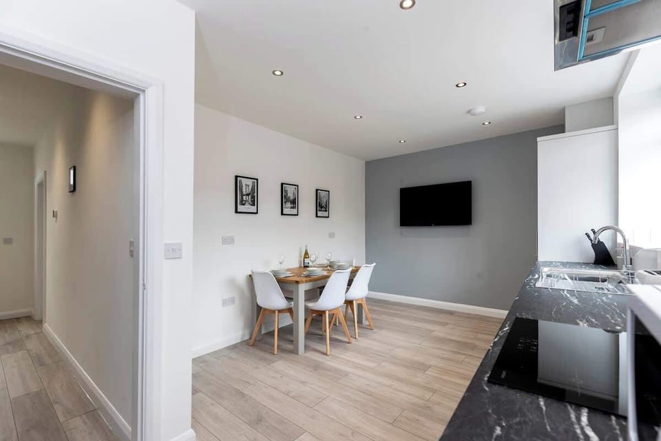 Step into a stylish dining room made for memorable meals and cosy evenings — complete with a table for four and its very own TV for dinner-and-a-show vibes