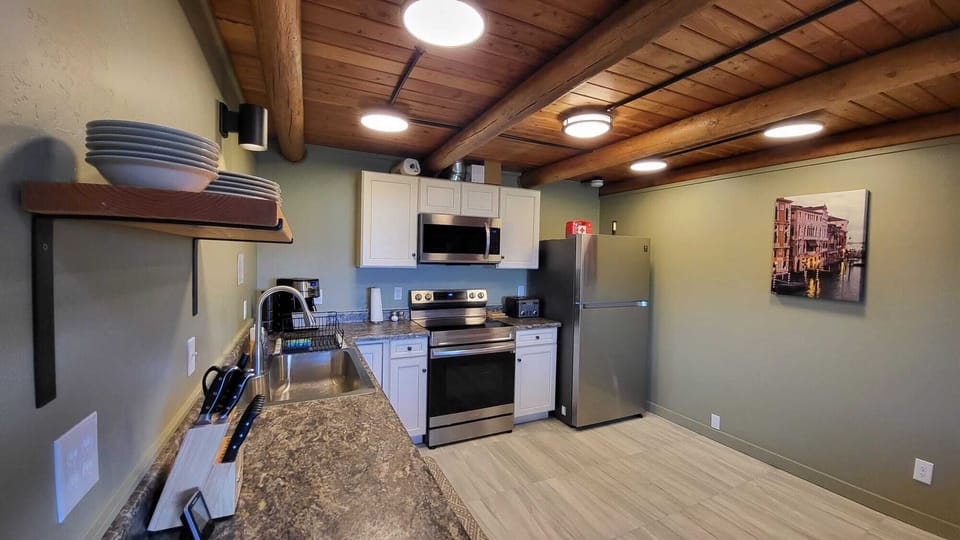 stovetop, refrigerator, indoor, oven, coffee and or coffee maker, microwave
