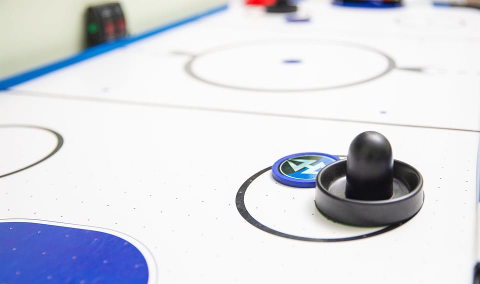 Gather for air hockey showdowns that turn downtime into high energy family bonding.