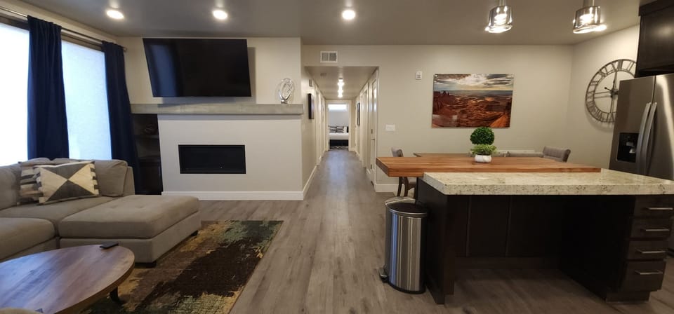 The living area opens seamlessly to the luxury kitchen.
