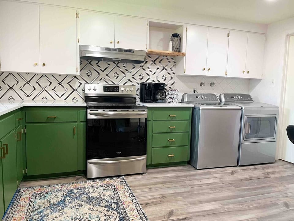Kitchen with quartz countertops.  Full size washer/dryer.  Dryer sheets and laundry pods (All Free and Clear) provided.