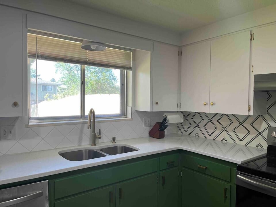 Bright, clean kitchen is fully stocked.