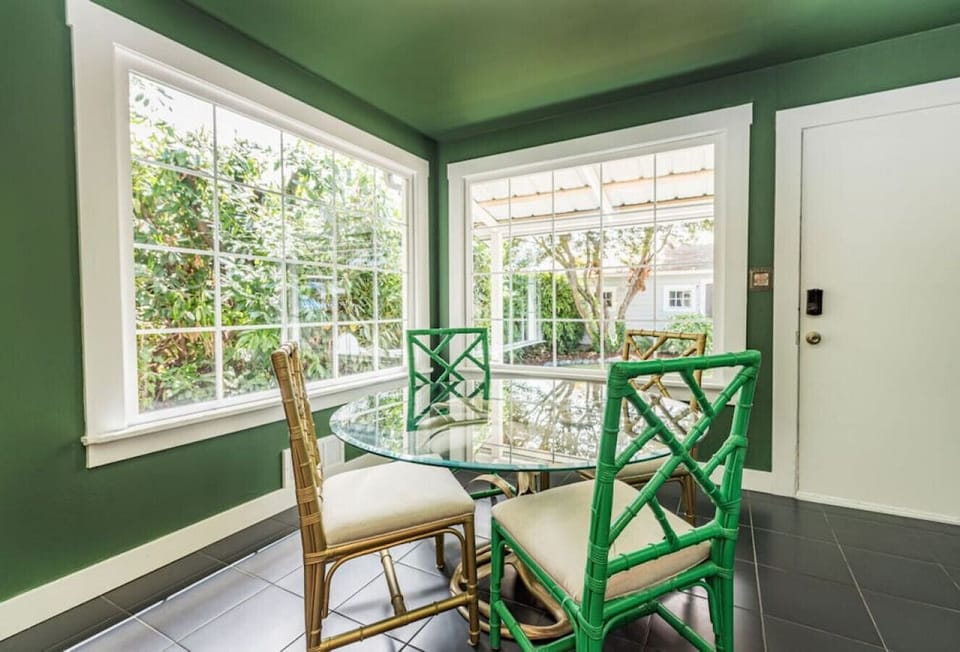 And the kitchen table seats four as well - it's the perfect spot to sit for breakfast or lunch while enjoying the greenery surrounding you!