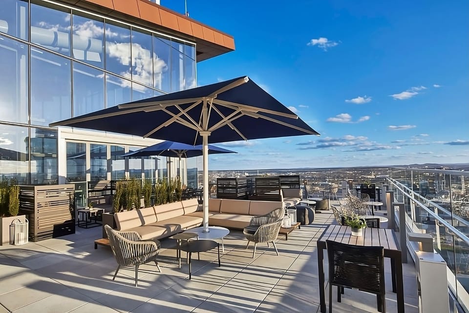 Sip cocktails outdoors with sweeping skyline views all around.
