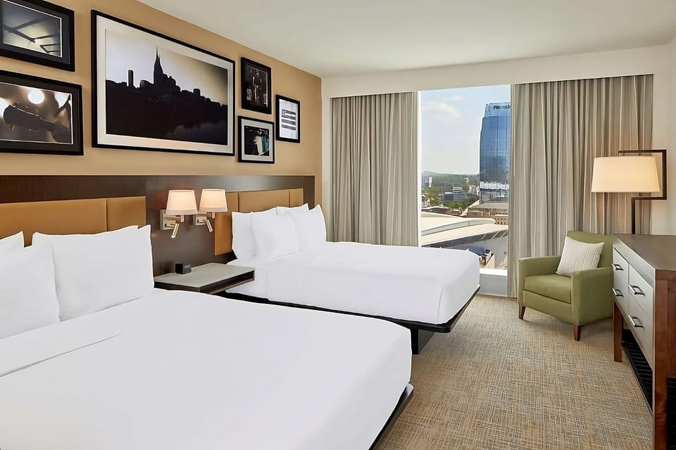 Wake up to sunny skyline glimpses from plush double queens.