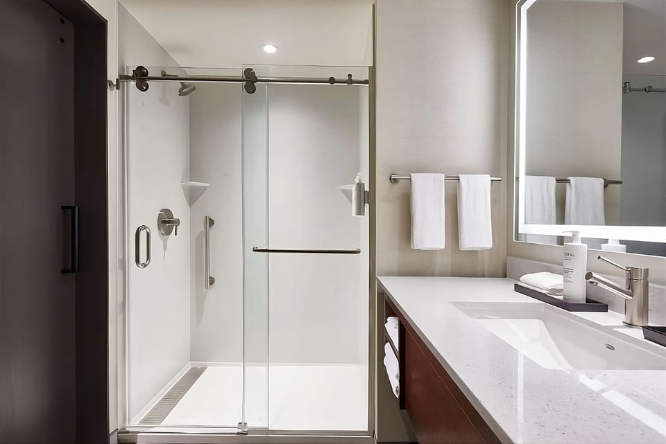 Refresh in a sleek walk-in shower with spotless finishes.