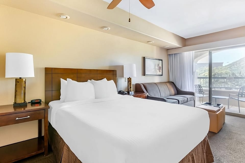 Wake up to mountain views from bed and private balcony.
