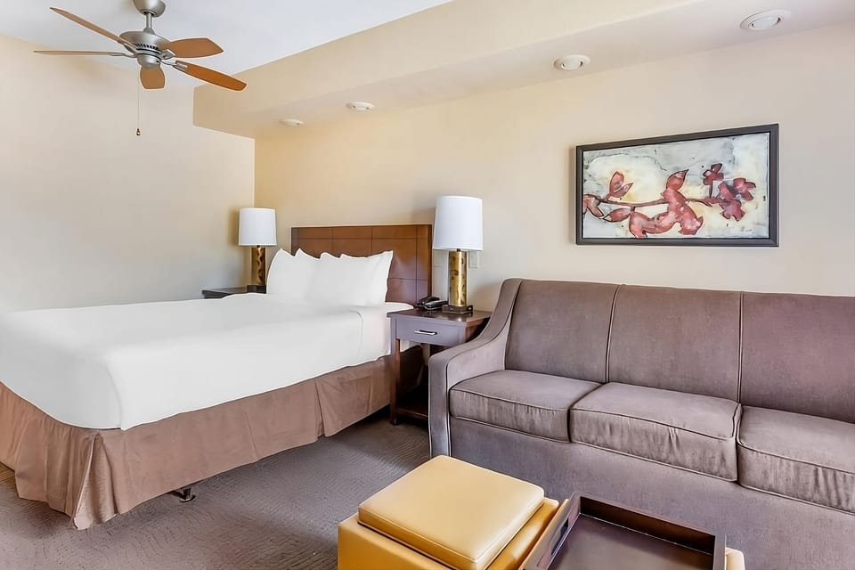 Lounge on the plush sofa after sinking into crisp linens.