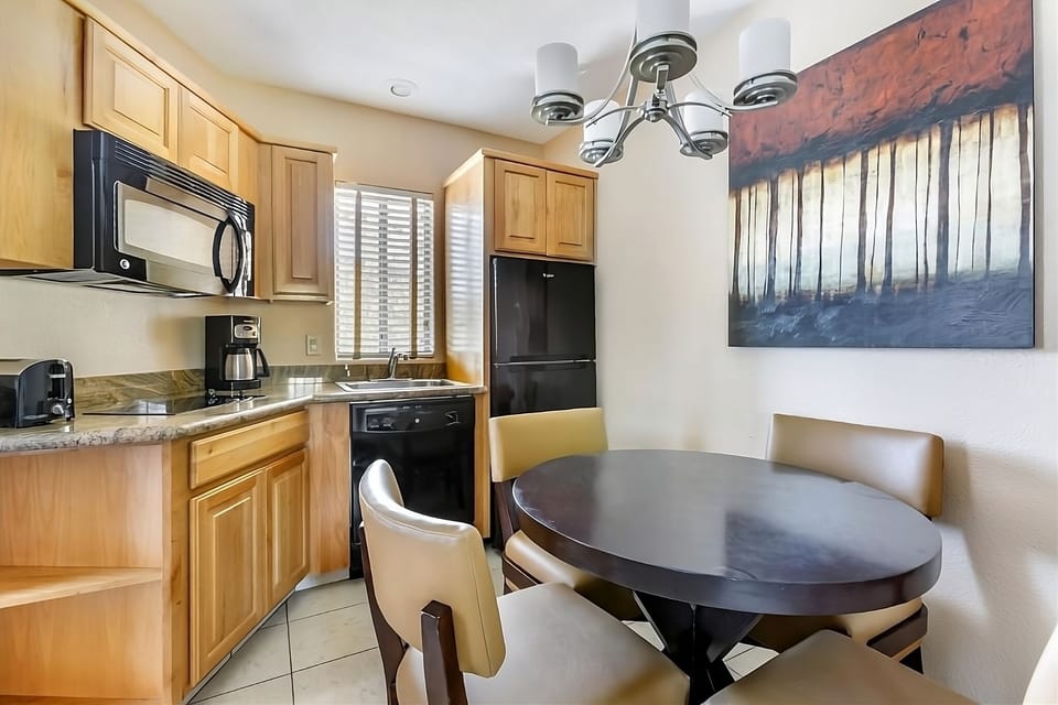 Cook and dine comfortably with a full kitchenette setup.