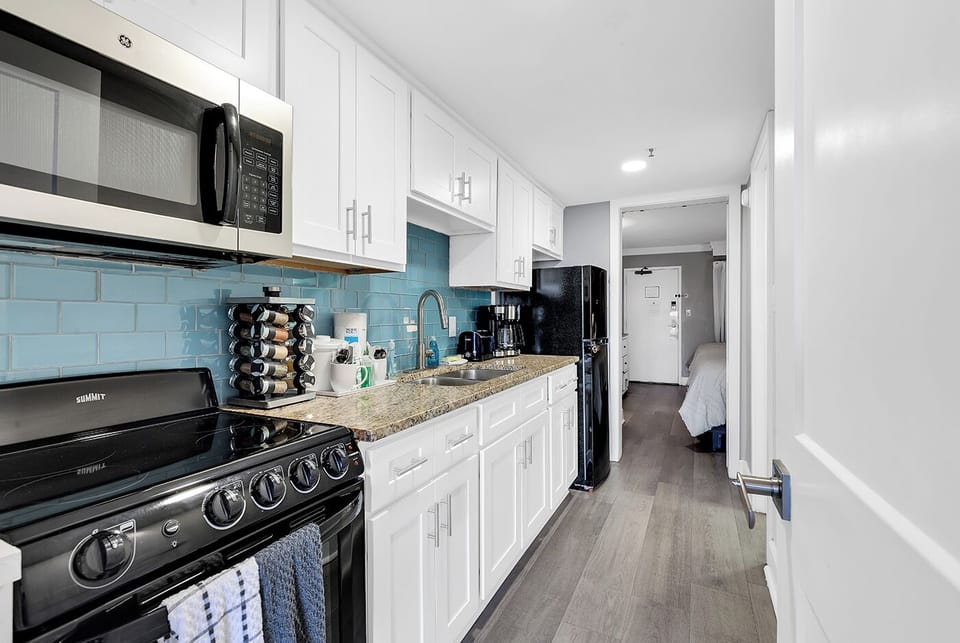 Quick access to the kitchen from either the bedroom space or the living room space.