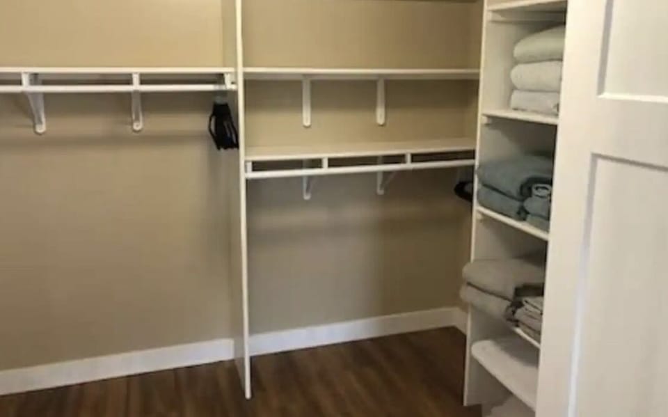 walk in closet in the queen bedroom.