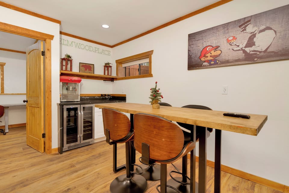 Cozy breakfast bar with seating, coffee station, and mini fridge. Perfect for morning routines, remote work, or casual dining in a warm, modern cabin setting.