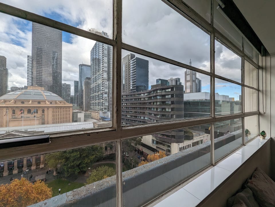 Wall to wall windows with sweeping city views