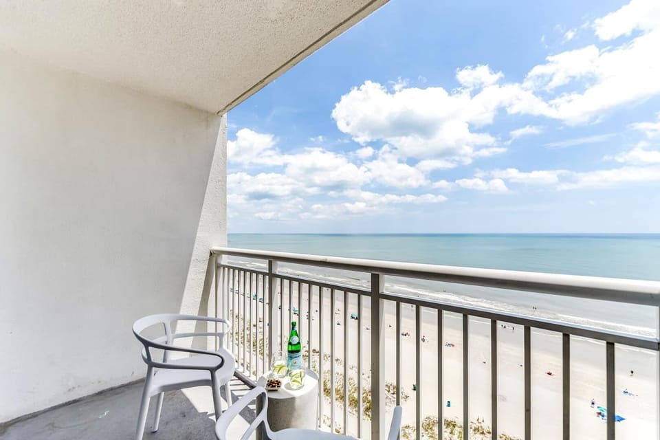 Relax on your private balcony with sweeping ocean views. The perfect spot to sip, savor, and soak up the serene beach vibes.