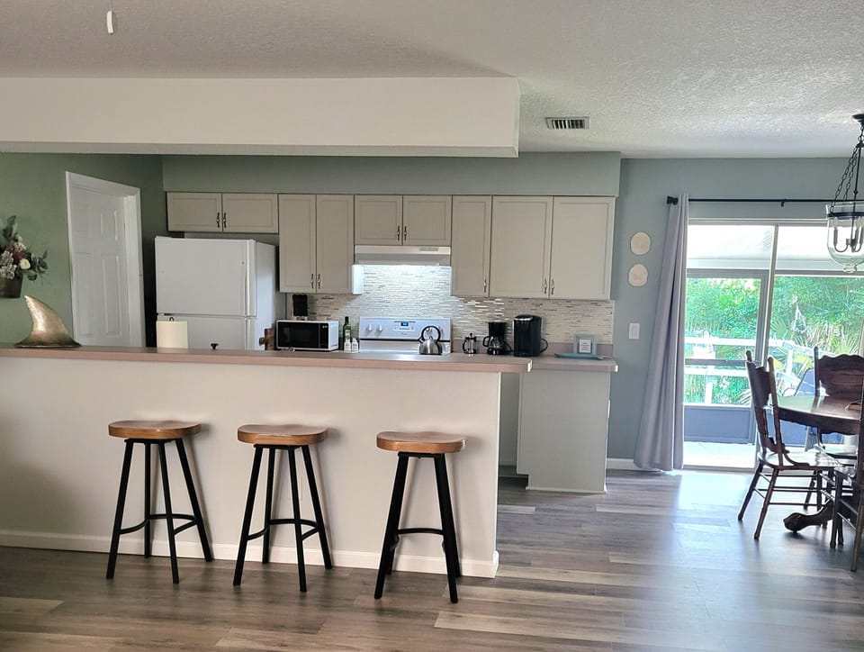 Open and Bright Kitchen with breakfast bar.