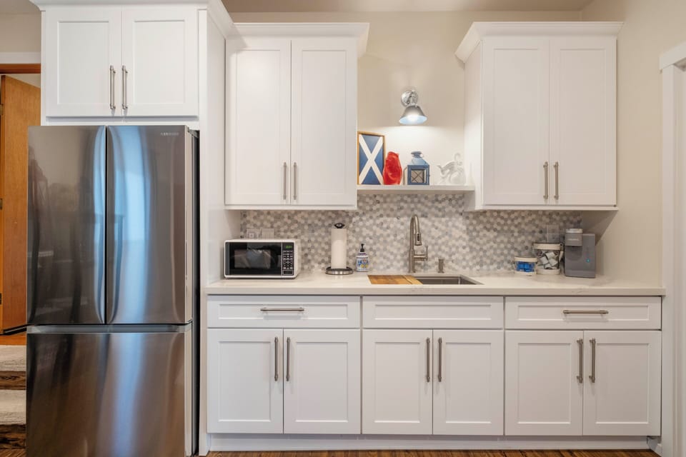 Kitchenette in with extra fridge and sink