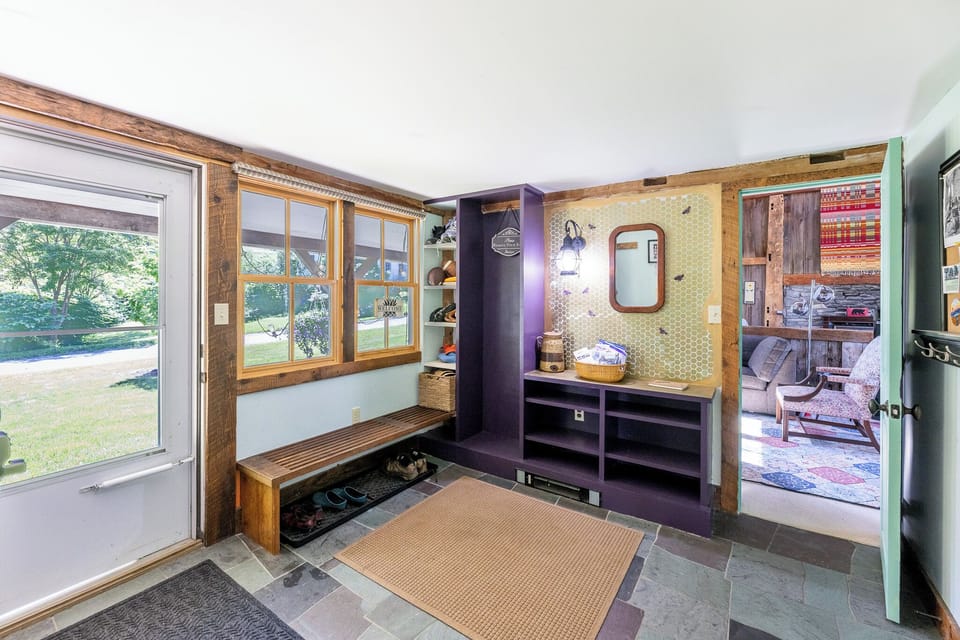 Mudroom opens into barn game room left and kitchen on right