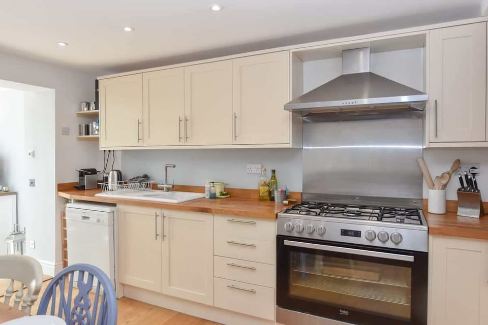 Alternate view of the lower ground kitchen and dining space showing layout and cabinetry.
