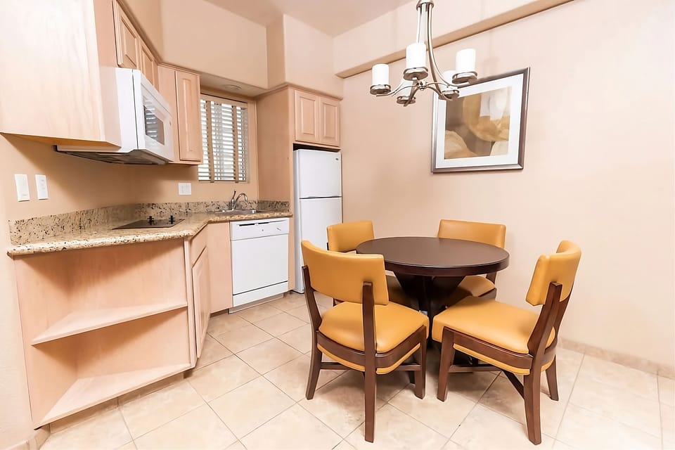 Gather for easy meals at the cozy dining table.