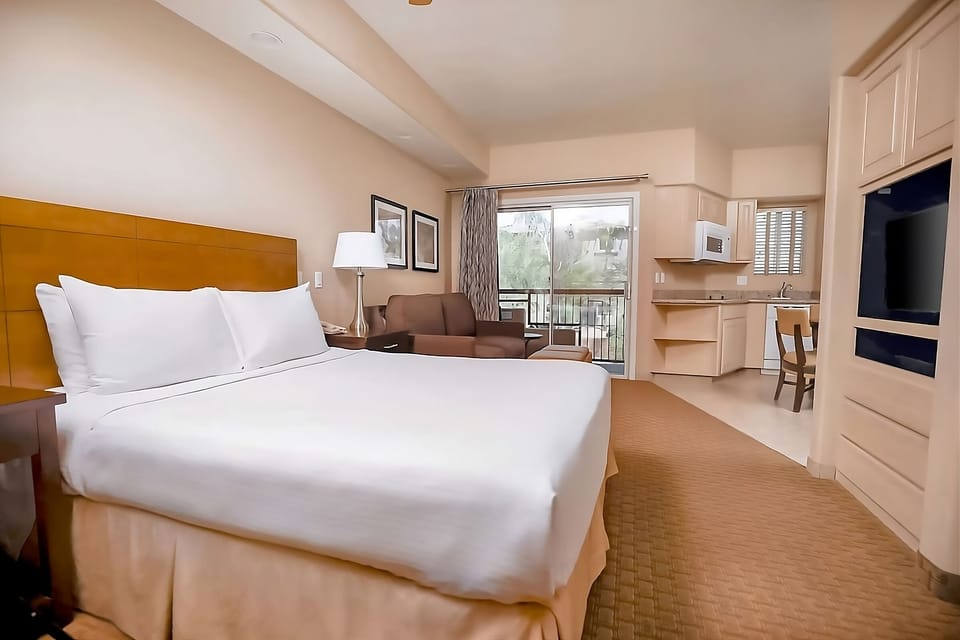 Settle into a spacious studio with kitchenette and lounge area.