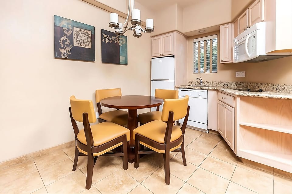 Gather for easy meals at the dining table beside kitchen.