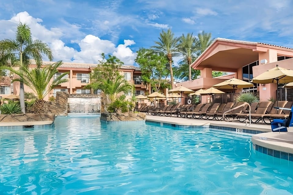 Float through the sparkling pool with waterfall views ahead.