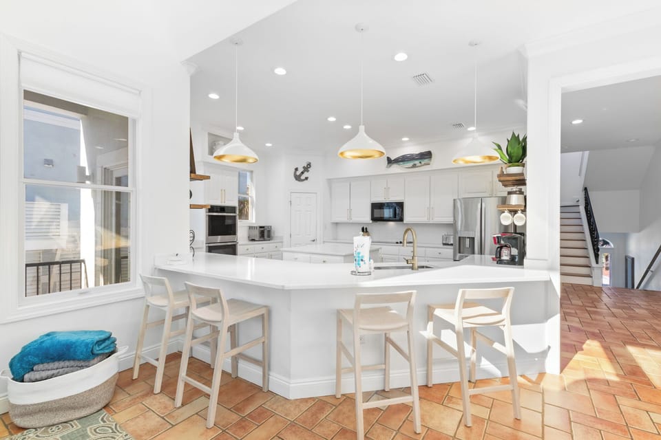 Gourmet kitchen fully stocked with all the gadgets and gizmos galore.  Anything you could need to cook for your family is there. 