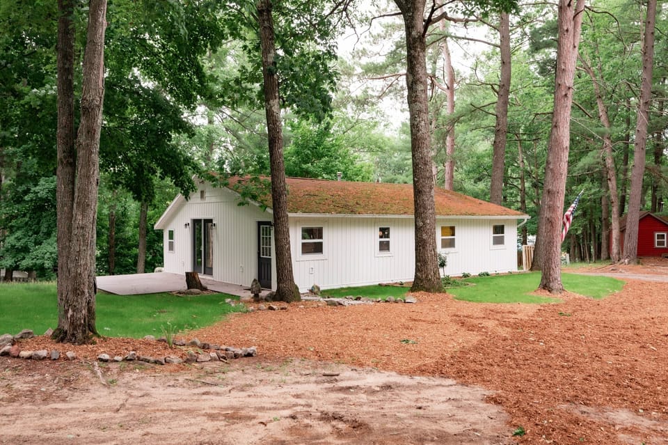 Enjoy nature's embrace in a charming sanctuary surrounded by towering pines!