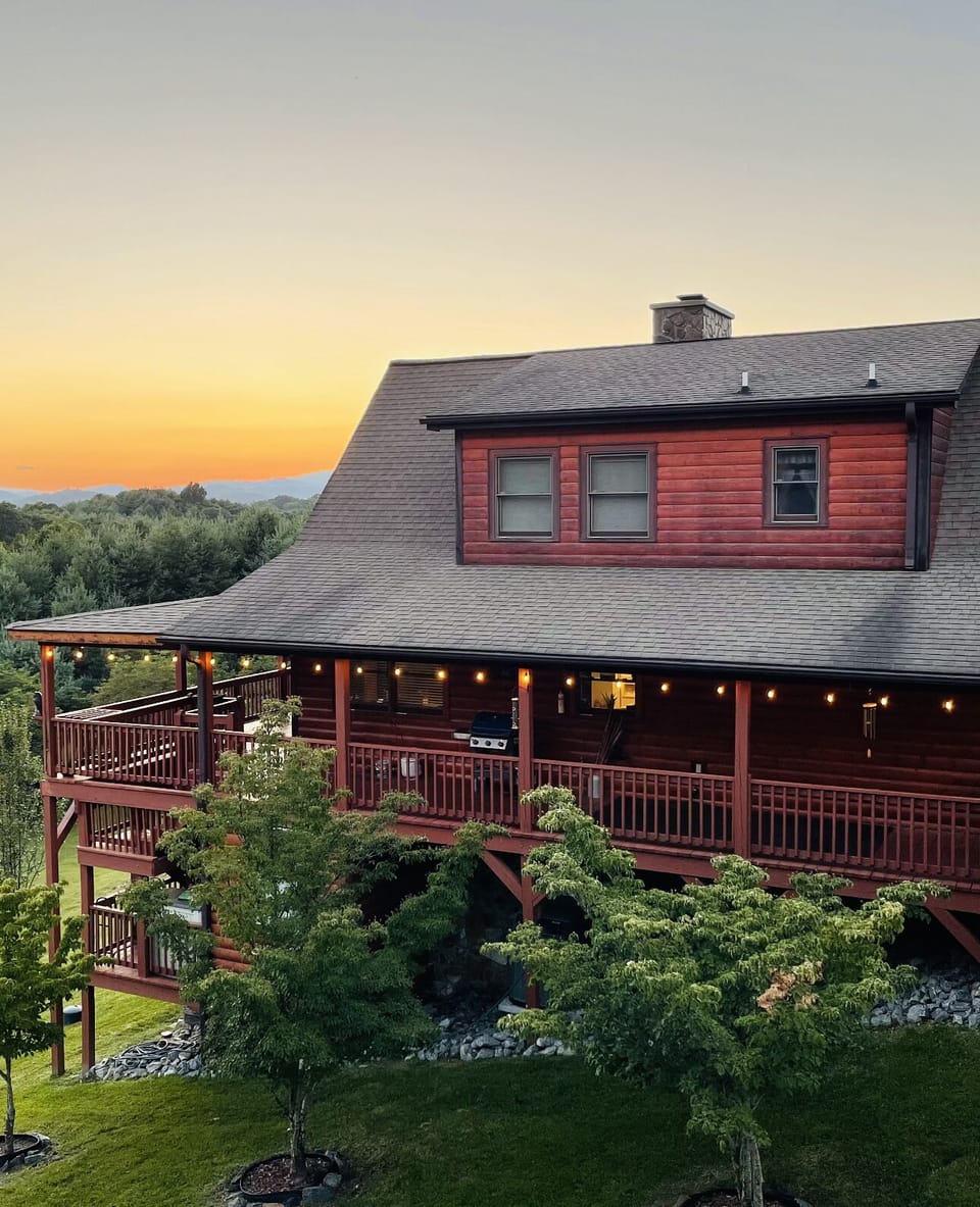 Side view of cabin at sunset