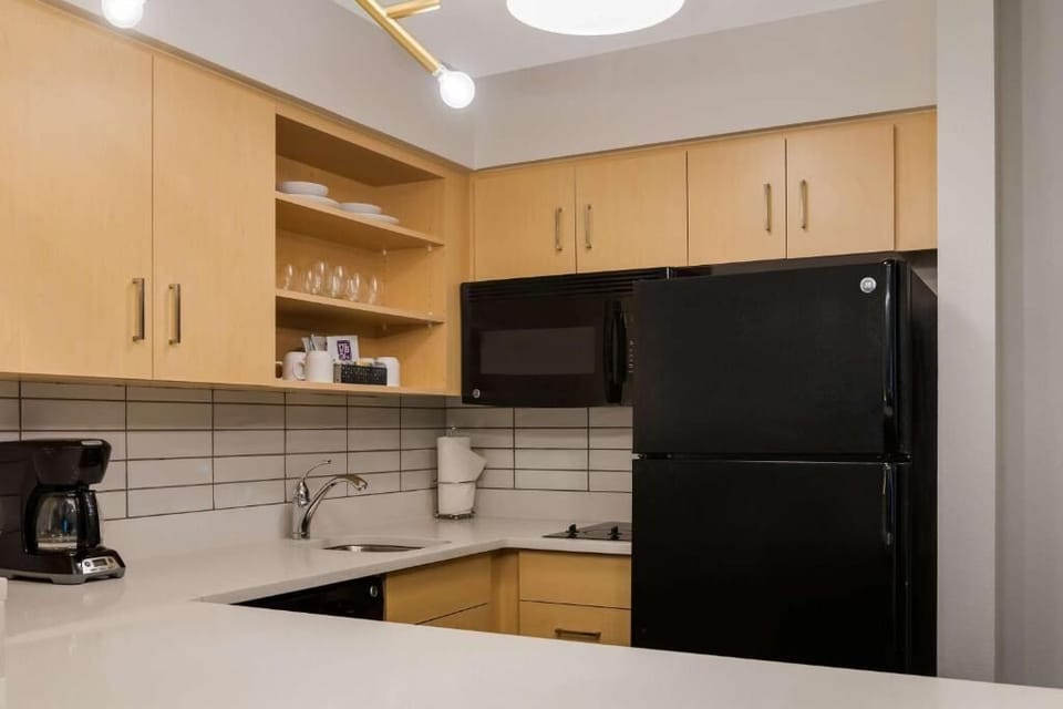 Brew morning coffee and prep snacks in this tidy kitchenette.