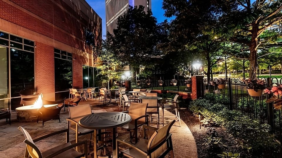 Relax outdoors at dusk beside the glowing fire pit.