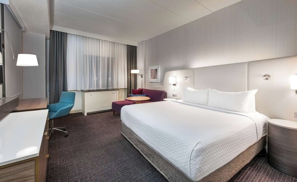 Stretch out and relax with plush seating beside your bed