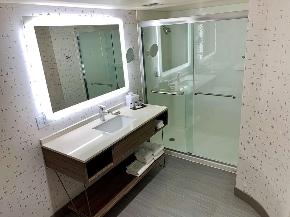 Enjoy a bright walk-in shower with plenty of counter space