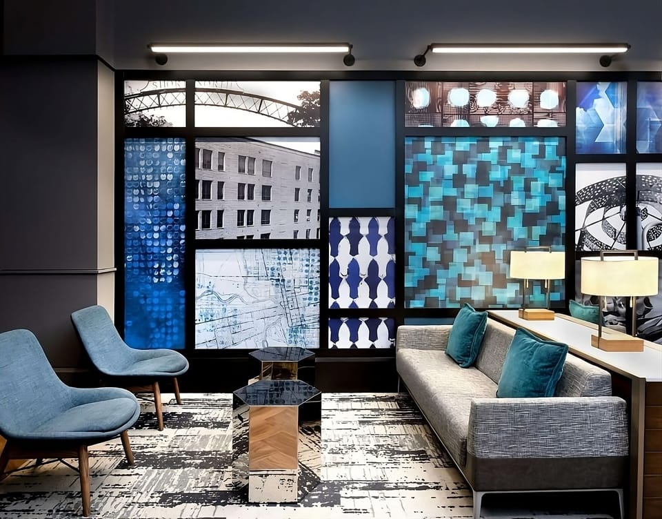 Relax on plush seating beside bold, gallery-style wall art.