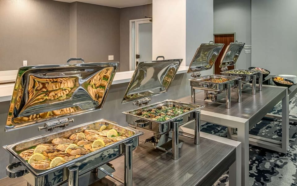 Gather for drinks at the contemporary bar with airy seating.