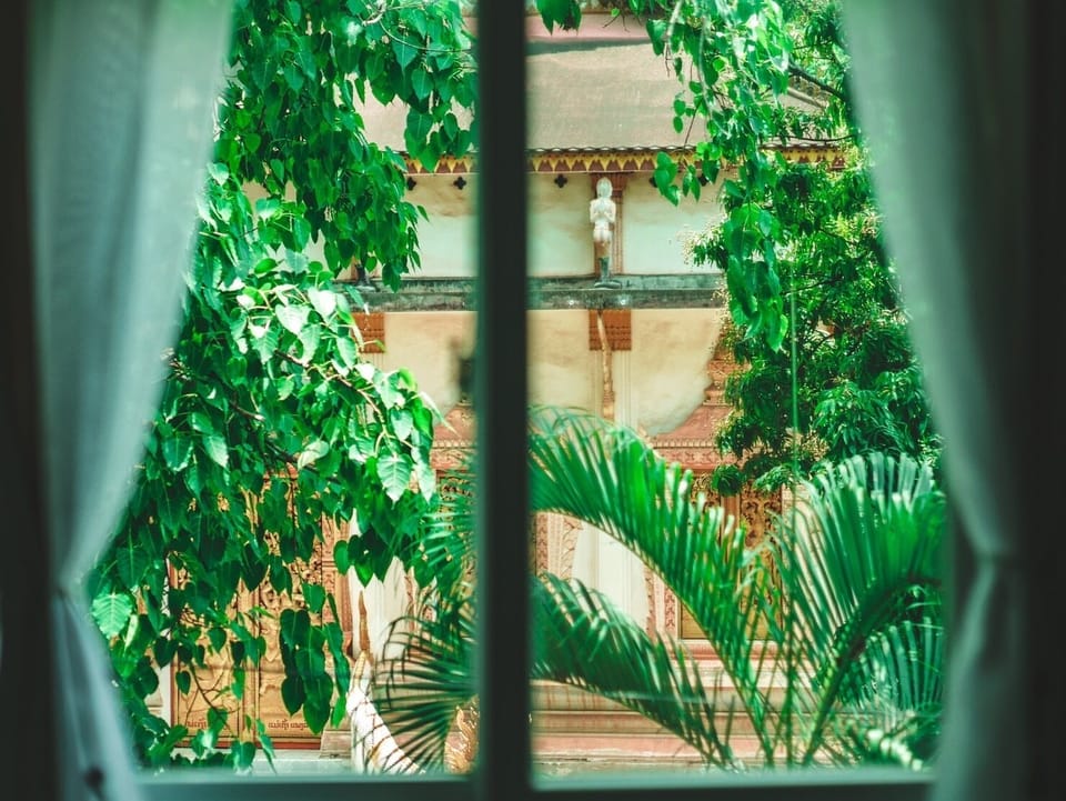 looking out the window, opposite to our place is one of the oldest temple in VTE