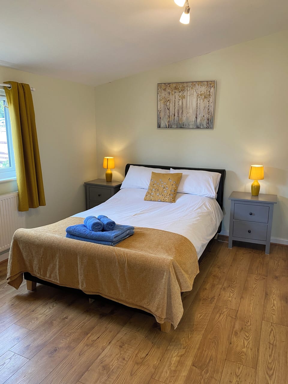 Double bedroom with 2 bedsides, chest of drawers and hanging space. 