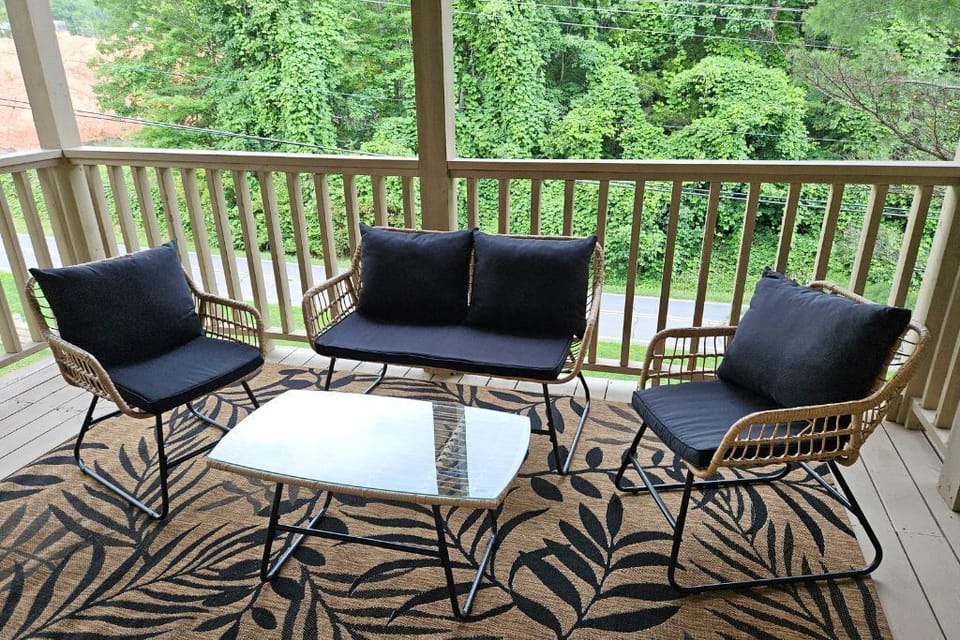 Back deck with nice outdoor furniture.