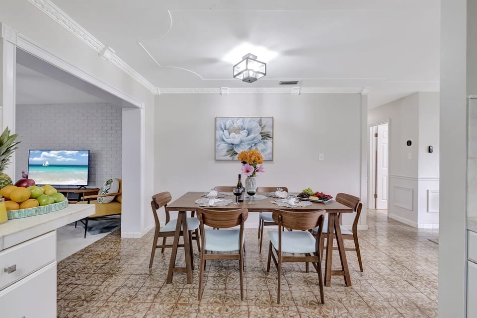 The rich wood of the table adds warmth and character to the room, making every meal feel like a special occasion.
