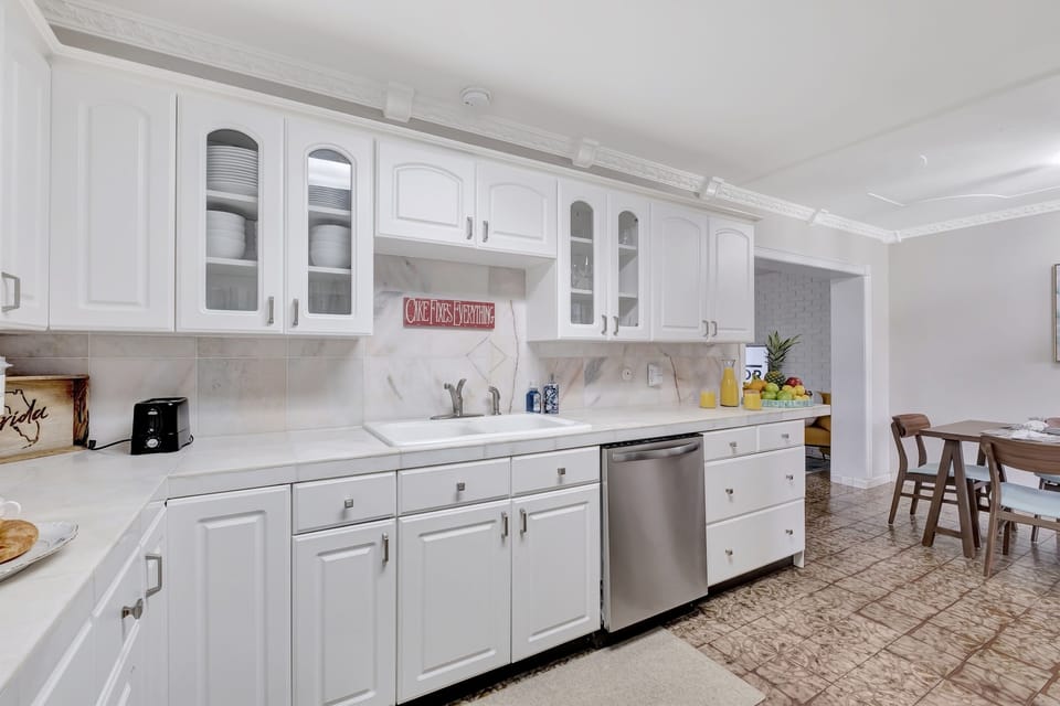 From the sleek refrigerator to the state-of-the-art oven and dishwasher, every detail has been meticulously designed to enhance your cooking experience.