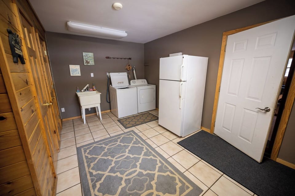 Huge laundry room with extra full sized refrigerator
