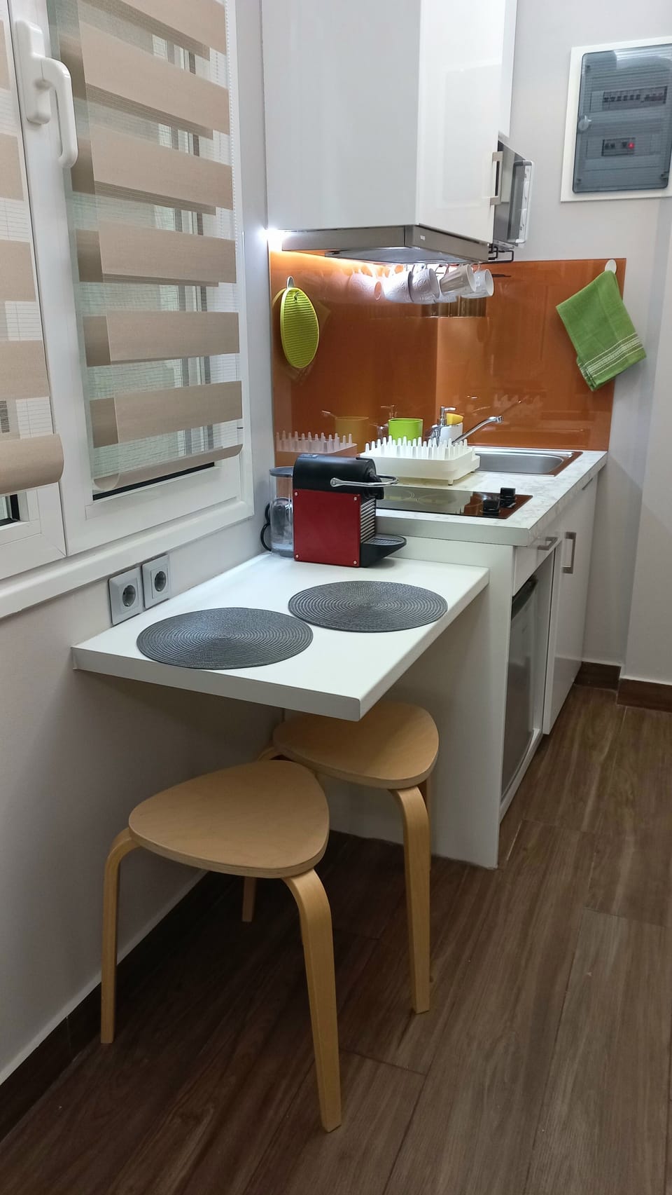 The compact  kitchenette with stove, mini fridge, coffee maker, kettle & toaster