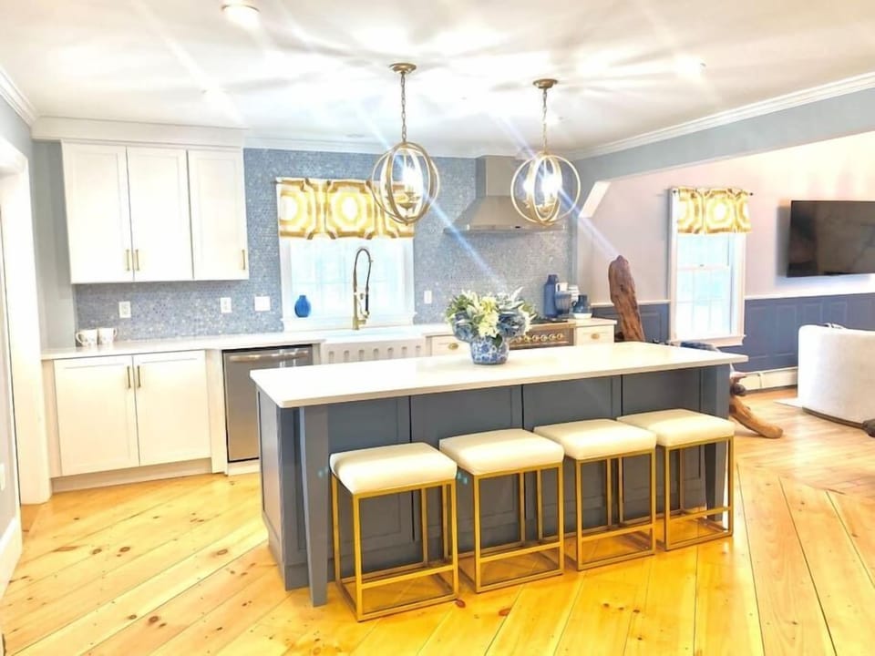 Gold accents with modern farmhouse blue elevate the space in fun and unique ways.