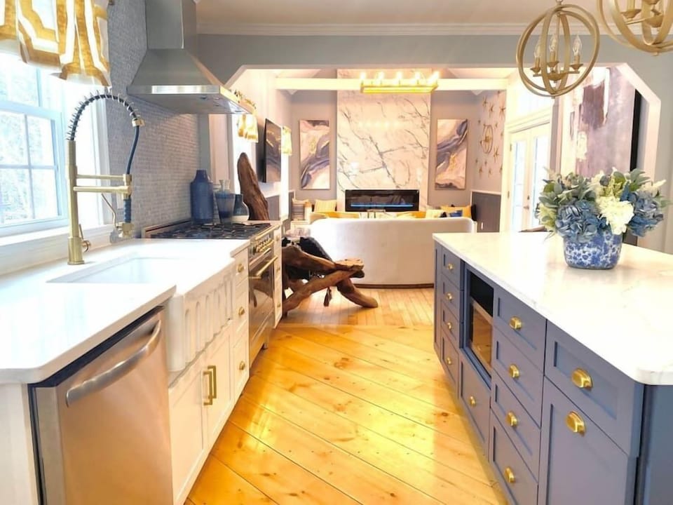 Grab a bite or gather around the island, the hub of this stunning kitchen. 